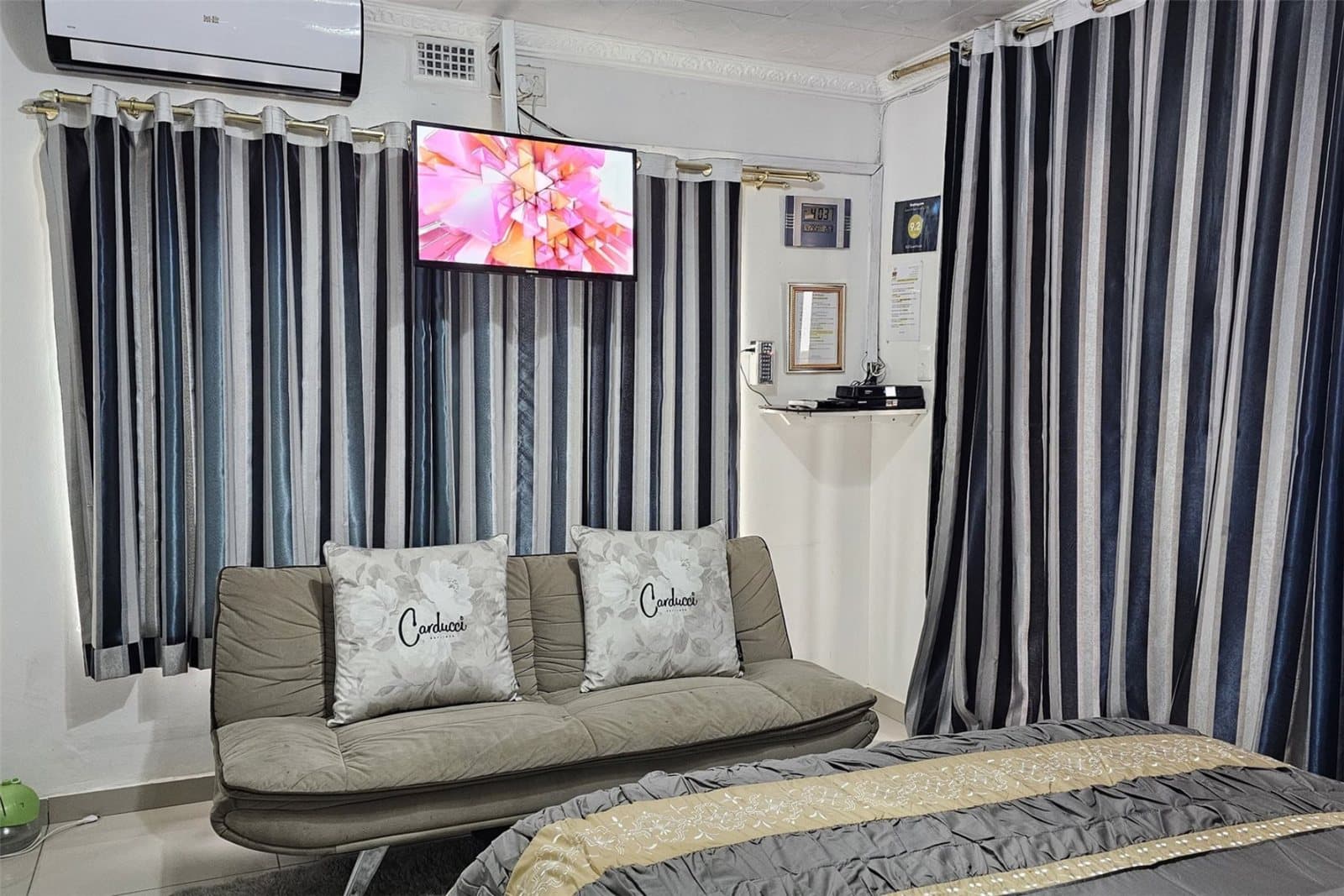 Lounge area with sleeper couch, flat-screen TV and air conditioning